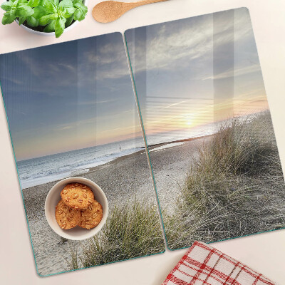 Schneidebrett glas Strand bei Sonnenuntergang