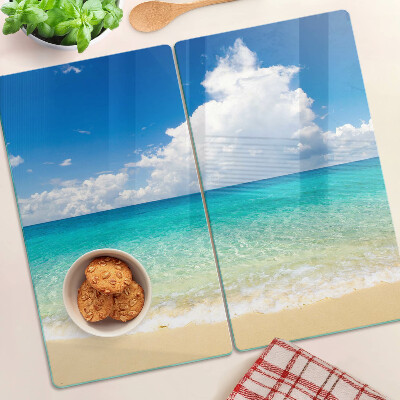 Schneidebrett glas Strand mit türkisfarbenem Wasser und Wolken