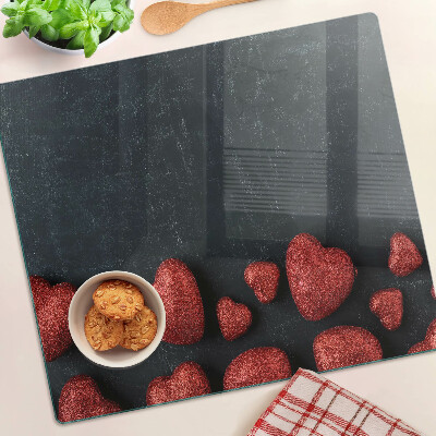 Glasschneidebrett Rote Herzen auf dunklem Hintergrund