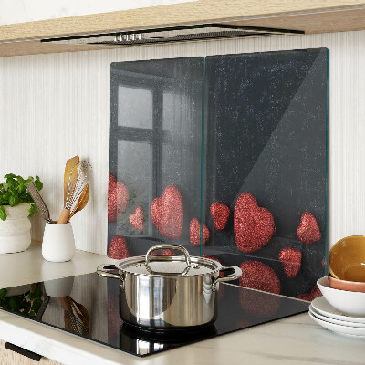 Glasschneidebrett Rote Herzen auf dunklem Hintergrund