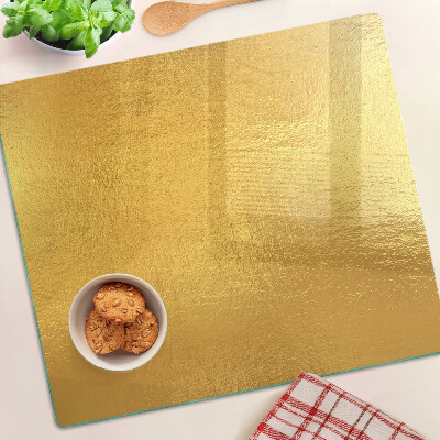 Schneidebrett glas Goldene Oberfläche mit Reflexionen