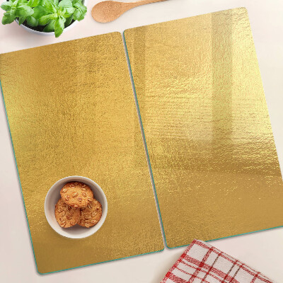 Schneidebrett glas Goldene Oberfläche mit Reflexionen