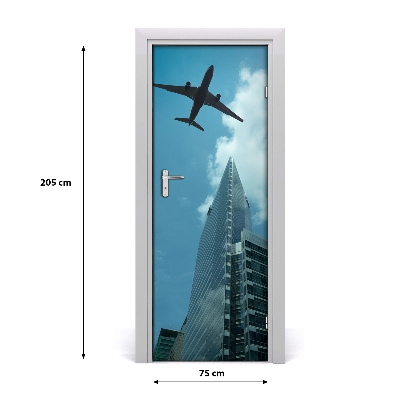 Selbstklebendes wandbild an der wand Flugzeug über die stadt