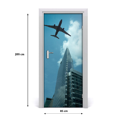 Selbstklebendes wandbild an der wand Flugzeug über die stadt