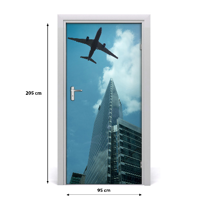 Selbstklebendes wandbild an der wand Flugzeug über die stadt
