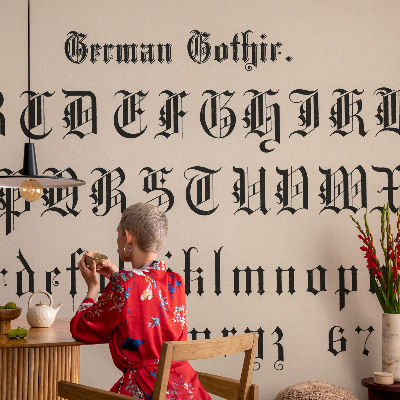 Dekorative Wand-Fototapete mit gotischen Buchstaben als Motiv