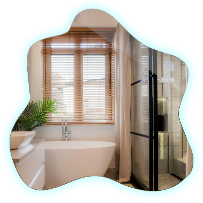 Spiegel in Klecksform LED-beleuchteter