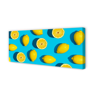 Leinwandbilder Zitronen auf einem blauen Hintergrund