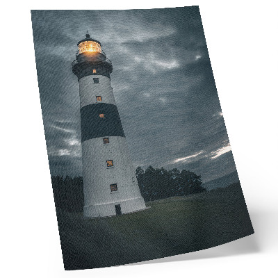 Kunstdruck leinwand Ein Leuchtturm vor einem bewölkten Himmel