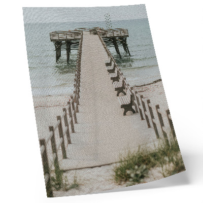 Wandposter Ein minimalistischer Pier, der direkt ins Meer ragt