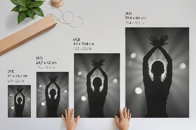 Wandposter Eine markante Silhouette gegen die Lichtstrahlen