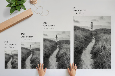 Wandposter Ein Leuchtturm vor dem Hintergrund von hohem Gras