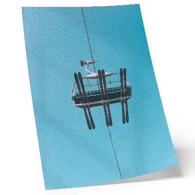 Leinwand-Kunstdruck Seilbahn vor blauem Himmel