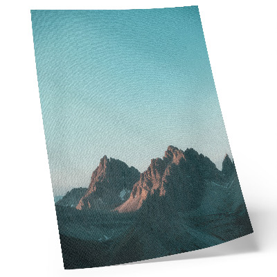 Wandposter Beeindruckende Berge unter strahlend blauem Himmel