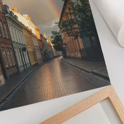 Leinwand Kunstdruck bunte Mietshäuser mit Regenbogen vor bewölktem Himmel