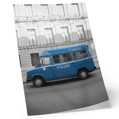 Kunstdruck leinwand Ein blauer Polizeiwagen vor einem Gebäude