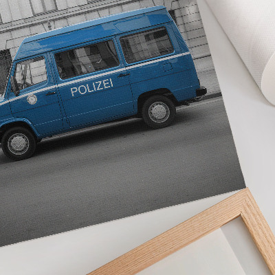 Kunstdruck leinwand Ein blauer Polizeiwagen vor einem Gebäude