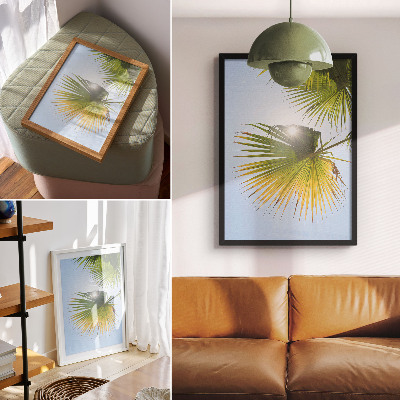 Wandposter Palmenblätter vor blauem Hintergrund Sonnenlicht
