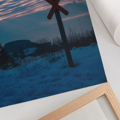 Kunstdruck leinwand Atmosphärische Winterlandschaft, bunte Wolken, einsames Schild