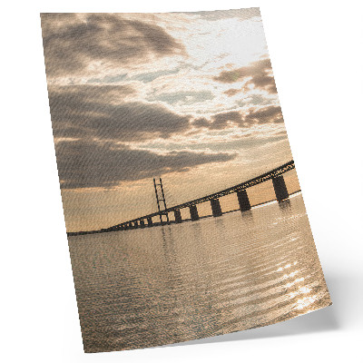 Kunstdruck leinwand Eine Brücke über das Wasser im Licht der untergehenden Sonne