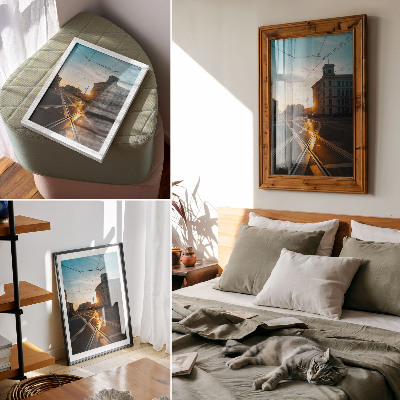 Wandposter Die untergehende Sonne über der Stadt mit ihrer Architektur