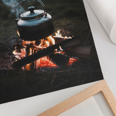 Poster Ein Kessel über einem Feuer im Wald am See