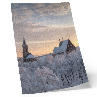 Wandposter Winterlandschaft mit einer schneebedeckten Kirche