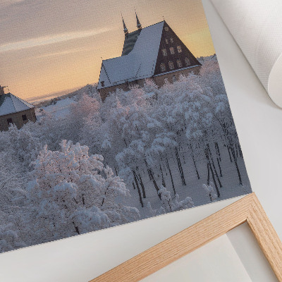 Wandposter Winterlandschaft mit einer schneebedeckten Kirche