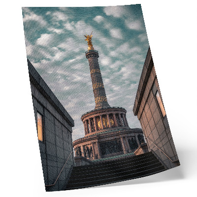 Kunstdruck leinwand Eine elegante Säule mit einem Engel und moderner Architektur