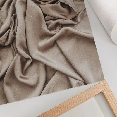 Wandposter beigefarbener Stoff mit zarten Falten für eine behagliche Atmosphäre