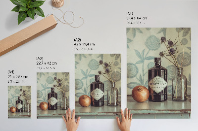 Kunstdruck leinwand Eine Flasche mit einem Blumenmuster im Hintergrund