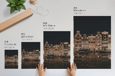 Poster Die nächtliche Stadt spiegelt sich im Wasser