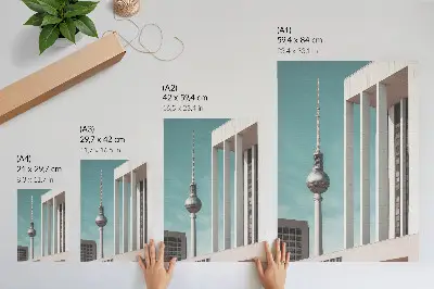 Poster minimalistischer Turm mit modernen Gebäuden unter blauem Himmel