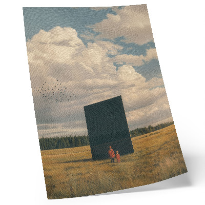 Wandposter Der Kontrast des schwarzen Monolithen zum Blau des Himmels und des Grüns