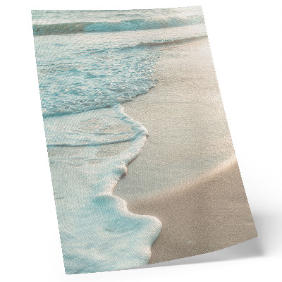 Kunstdruck leinwand Sanfte Wellen plätschern an den Sand, eine ruhige Atmosphäre