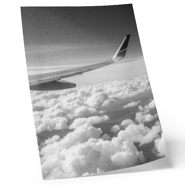Kunstdruck leinwand Flugzeugflügel über den Wolken, Schwarz-Weiß-Stil