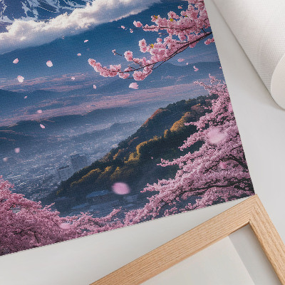 Poster Berge und blühende Kirschbäume vor einem rosa Himmel