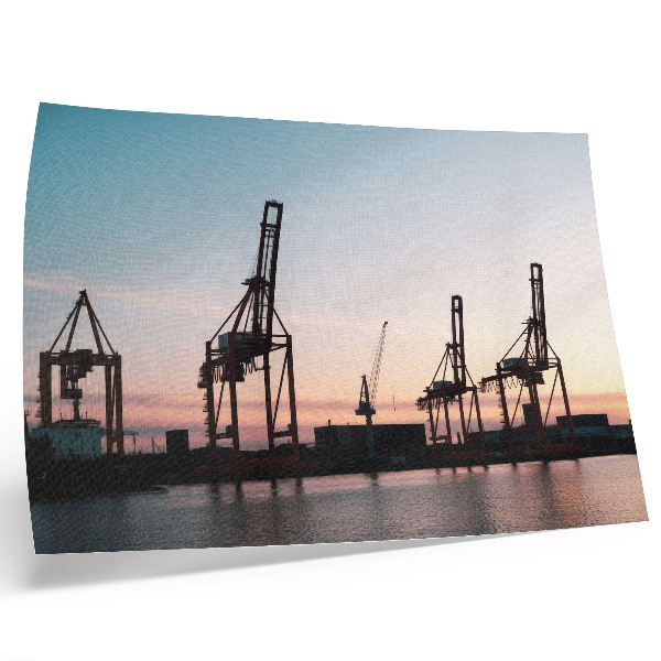 Kunstdruck poster Kräne im Hafen bei Sonnenuntergang