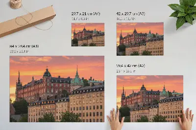 Poster mit einem Sonnenuntergang über charmanten historischen Gebäuden