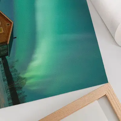 Nordlichter über dem Winterhaus Poster