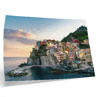 Kunstdruck poster Bunte Häuser auf einer Klippe über dem Meer