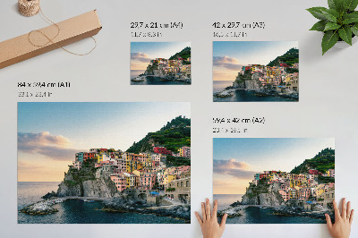 Kunstdruck poster Bunte Häuser auf einer Klippe über dem Meer