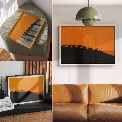 Kunstdruck poster Silhouetten von Hirschen auf einem Hügel vor orangefarbenem Hintergrund