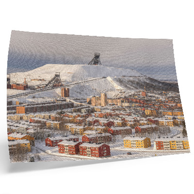 Poster Winterstadt mit farbenfrohen Gebäuden, die einen Kontrast zum Schnee bilden
