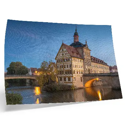 Poster historisches Gebäude an einer Brücke über dem Wasser bei blauem Himmel