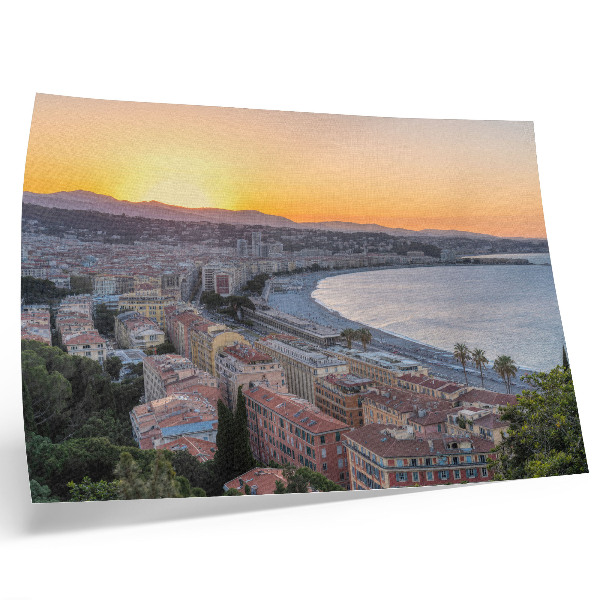 Kunstdruck poster Blick auf die Stadt bei Sonnenuntergang über dem Meer