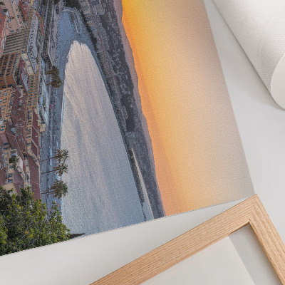 Kunstdruck poster Blick auf die Stadt bei Sonnenuntergang über dem Meer