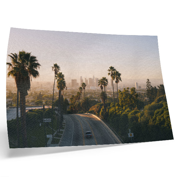 Kunstdruck poster Palmen und die Skyline der Stadt im Sonnenschein