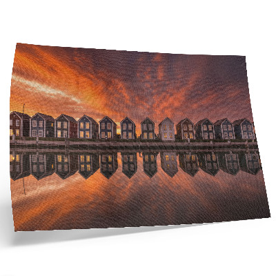 Poster Bunte Häuser am Wasser im Licht der Abenddämmerung
