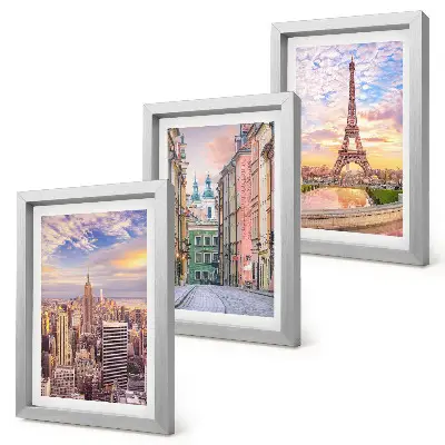 Bilderwand mit einer Ansicht der Städte New York, Paris und Warschau in der Abenddämmerung